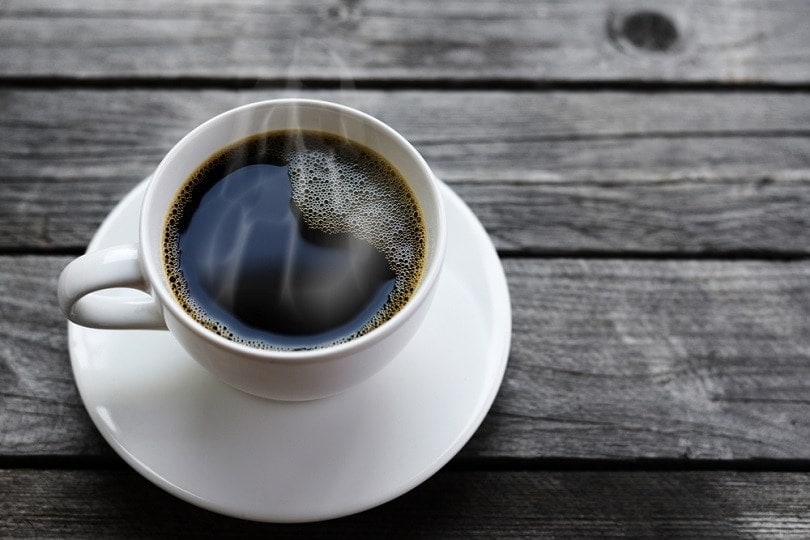 cup of coffee on wooden table
