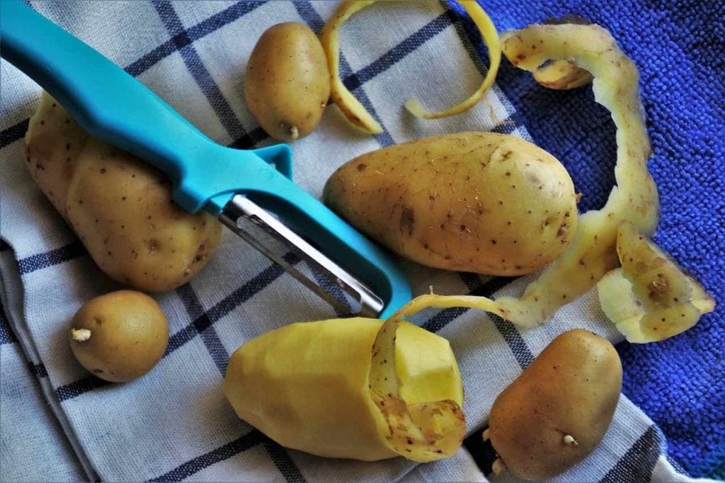 peeling potatoes and potato skins