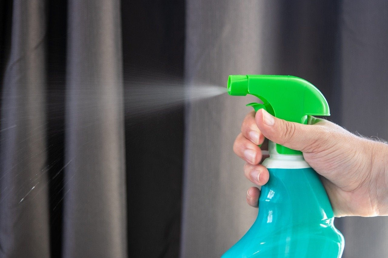 spraying disinfectant