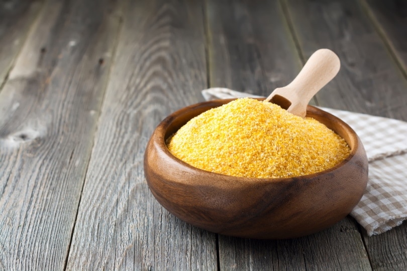 Corn grits in a wooden bowl