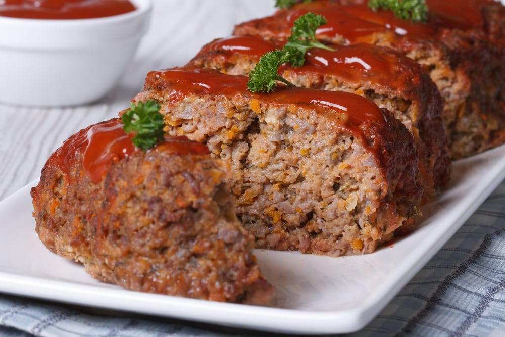 Sliced meatloaf with ketchup and parseley