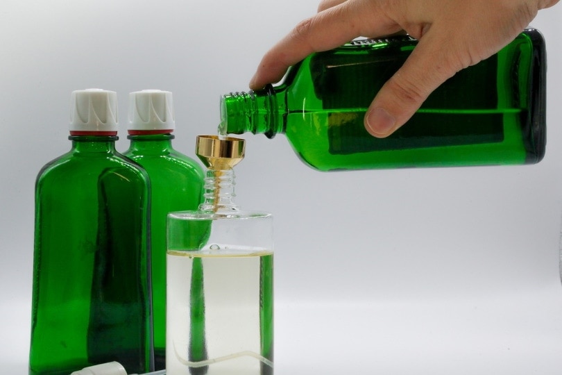 Bottle being filled with liquid