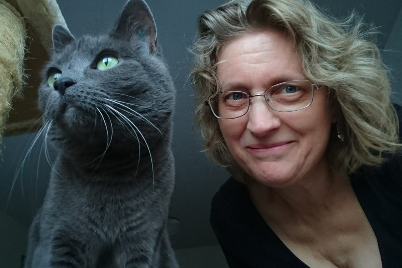 Woman posing with cat