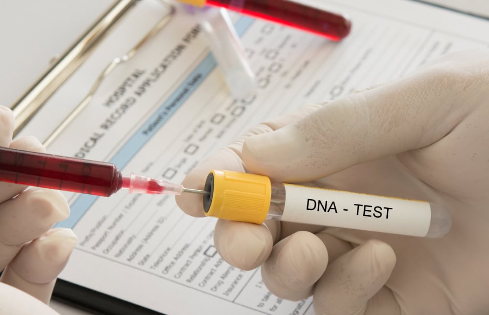 syringe blood sample into dna test tube