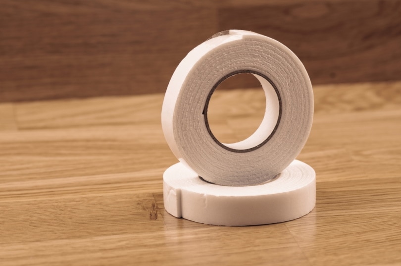 double sided tape on wooden background