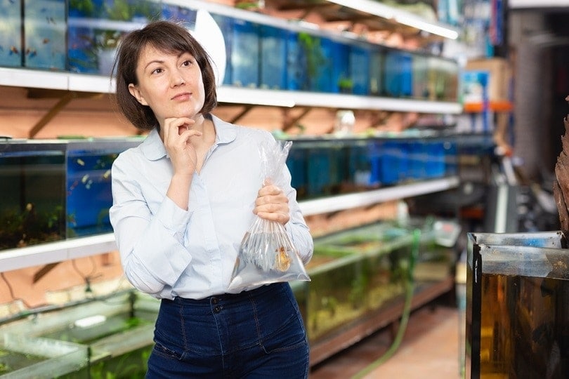 happy-young-woman-with-goldfish_Iakov-Filimonov_shutterstock