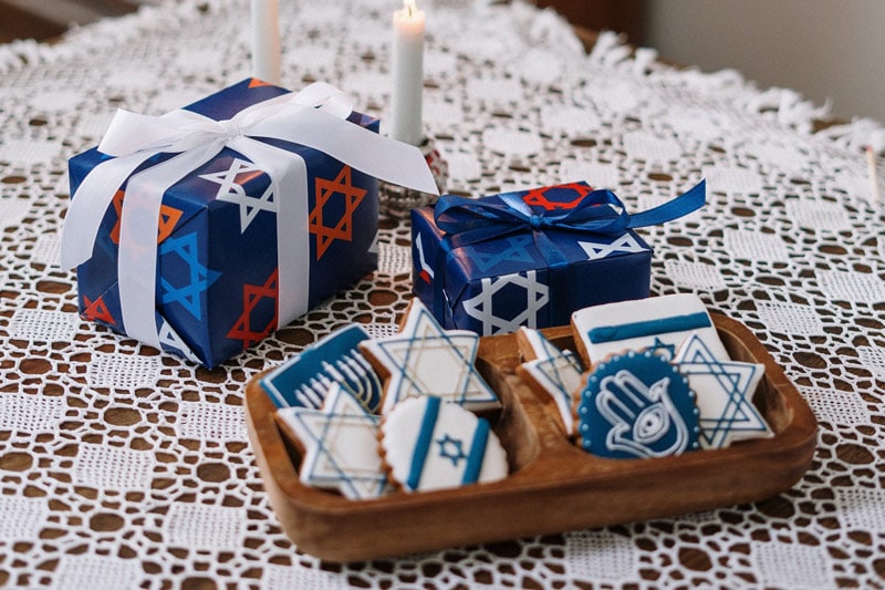 gifts and cookies for hanukkah on the table