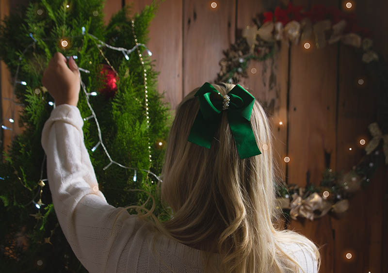 Woman setting up christmas lights