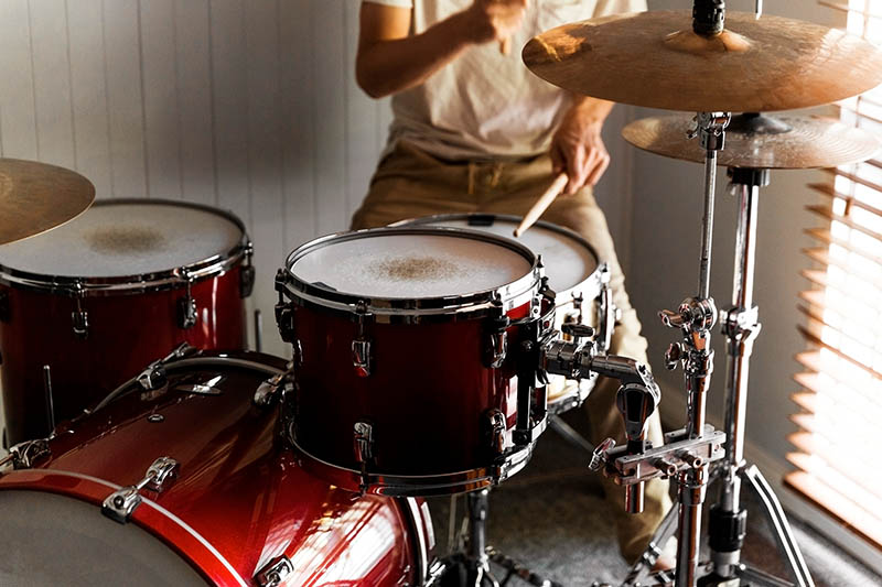person playing drums at home