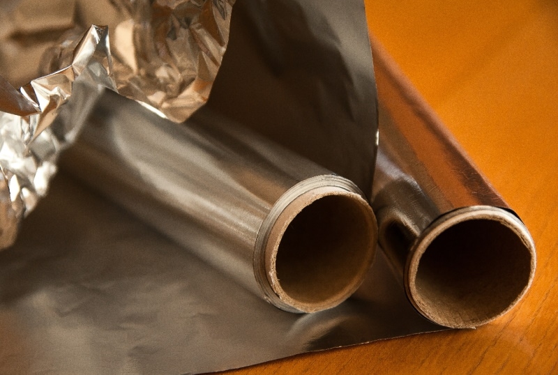 Rolls of aluminum foil on the counter