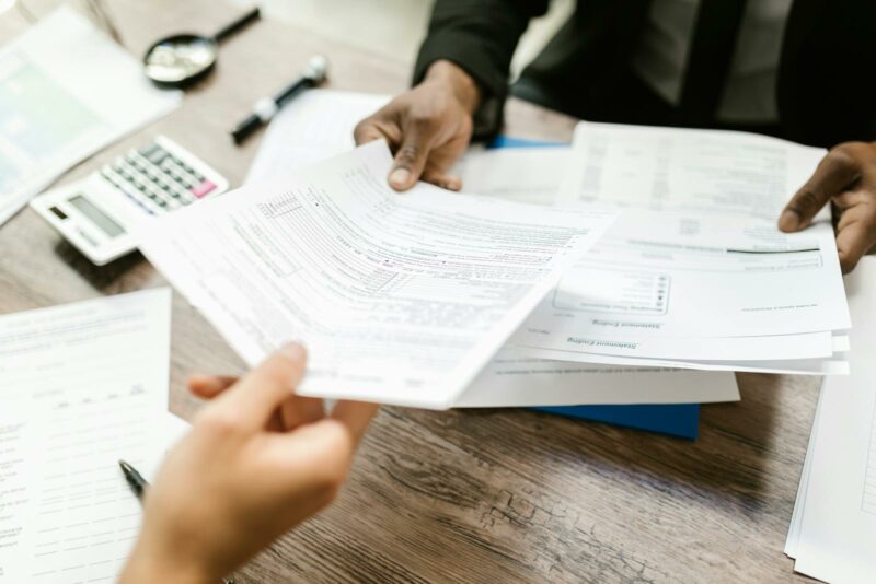 man handing the insurance documents