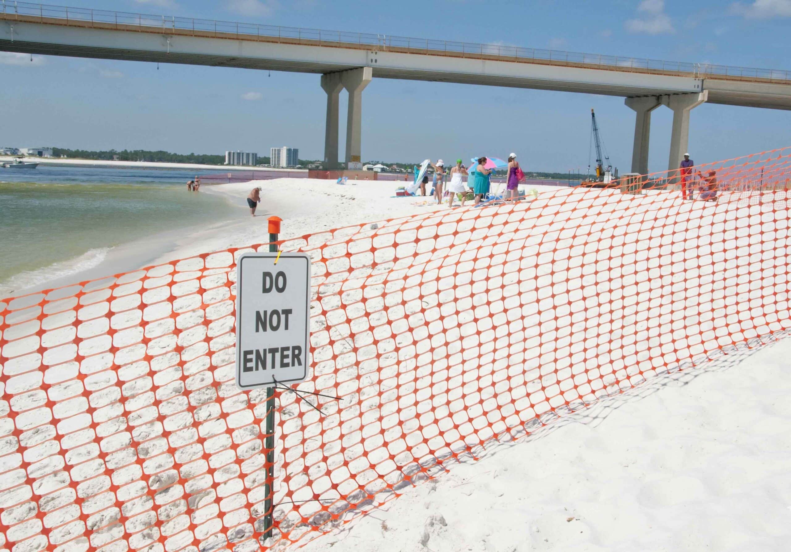 ORANGE BEACH, AL - JUNE 10: Beach-goers are asked to leave the area as a portion of Perdido Pass, AL is cordoned off on June 10, 2010.