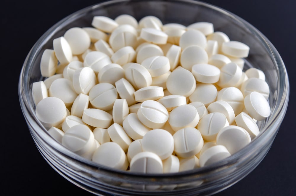 melatonin tablets in a glass bowl