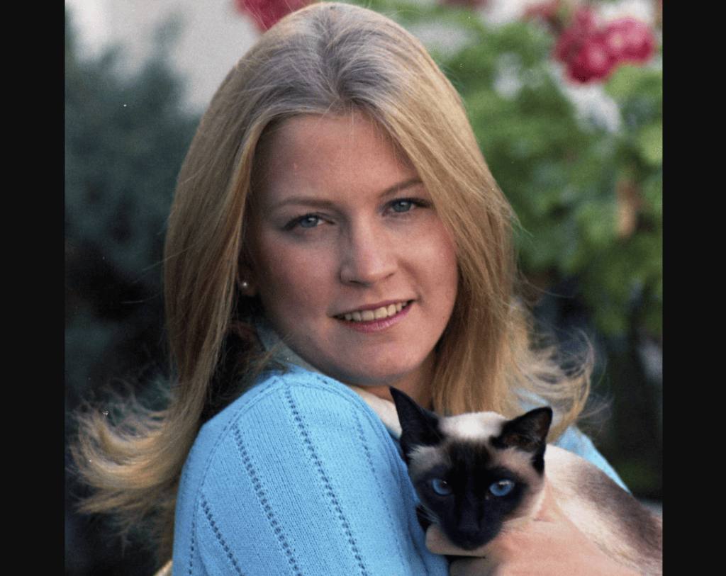 Susan Ford with Shan, the Ford Family's Siamese Cat