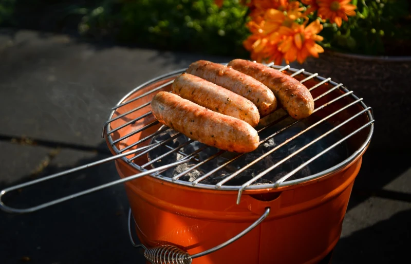 bratwurst sausages cooking on a grill