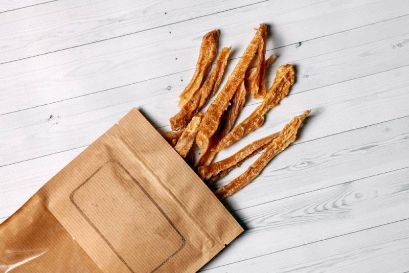 sliced turkey or chicken meat dehydrated and packed into craft brown paper