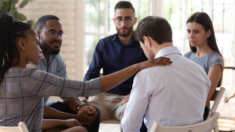 support group comforting their friend