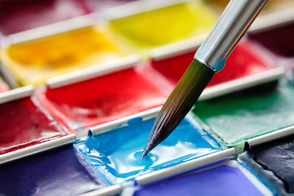 close up brush dipping on watercolor