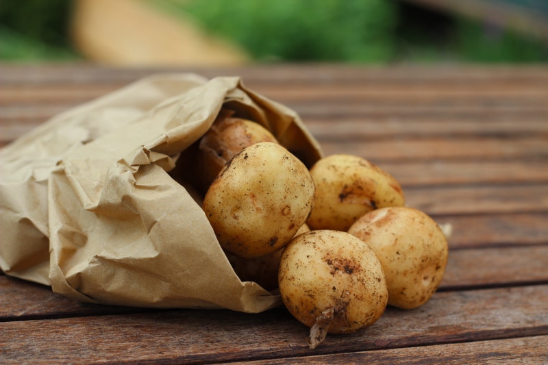 potatoes on wooden table