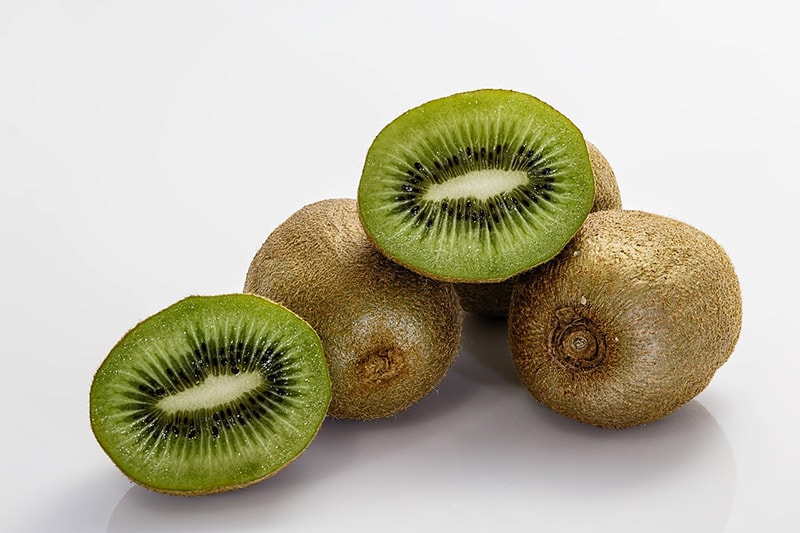 sliced and whole kiwis