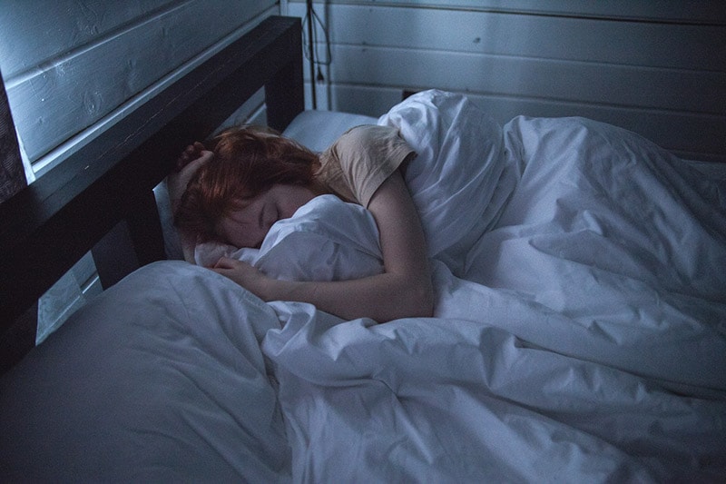 woman sleeping on the bed