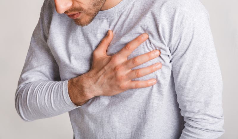 man experiences chest pain or Shortness of breath or Increased heart rate