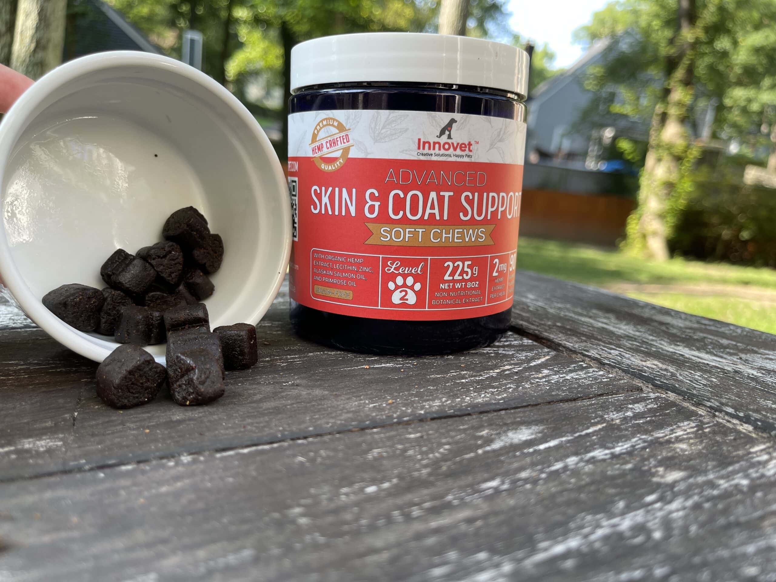 innovet advanced skin & coat support soft chews in the container next to container