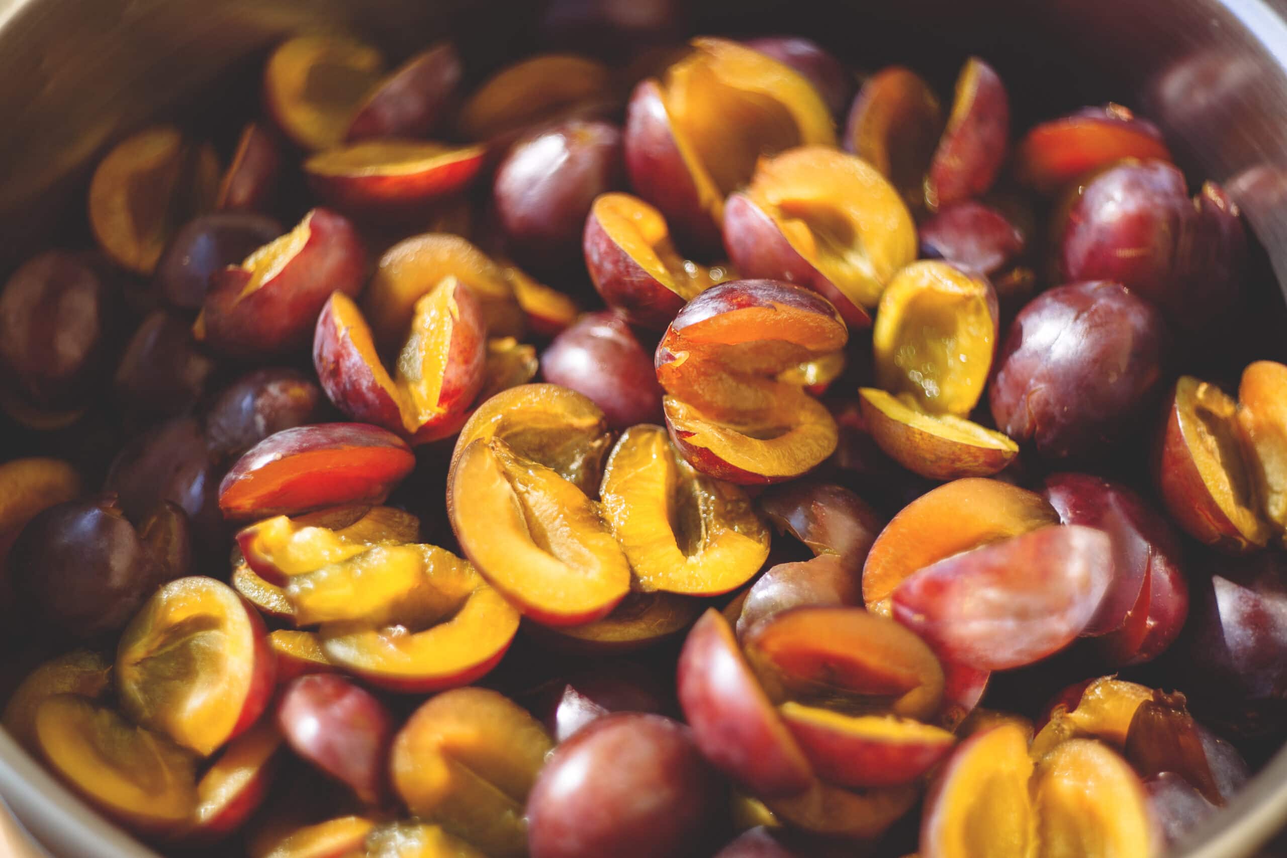 Sliced plums in a bowl