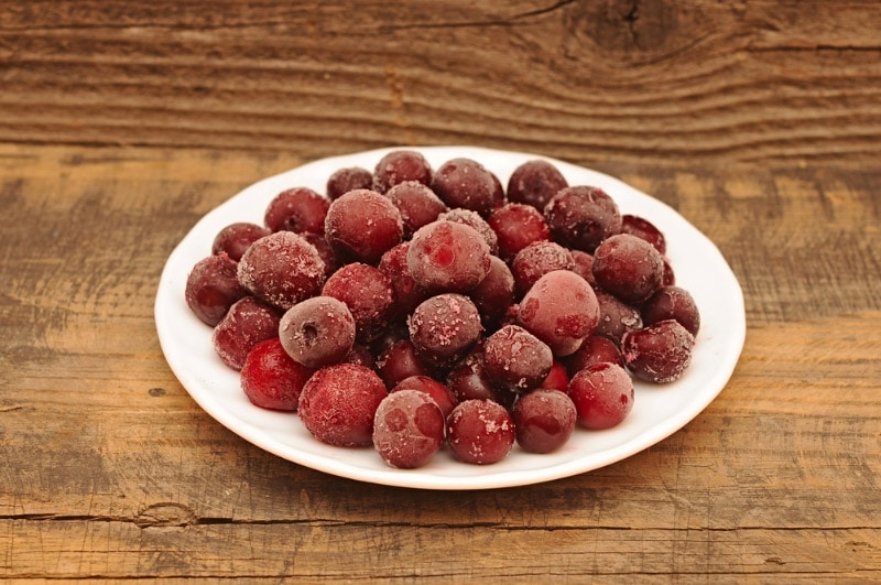 ripe frozen cherries on plate