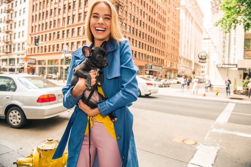 woman holding french bulldog