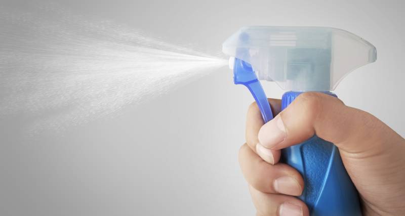 mist of a spray bottle spraying water into the air