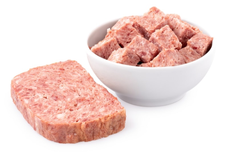 Diced canned meat in a bowl