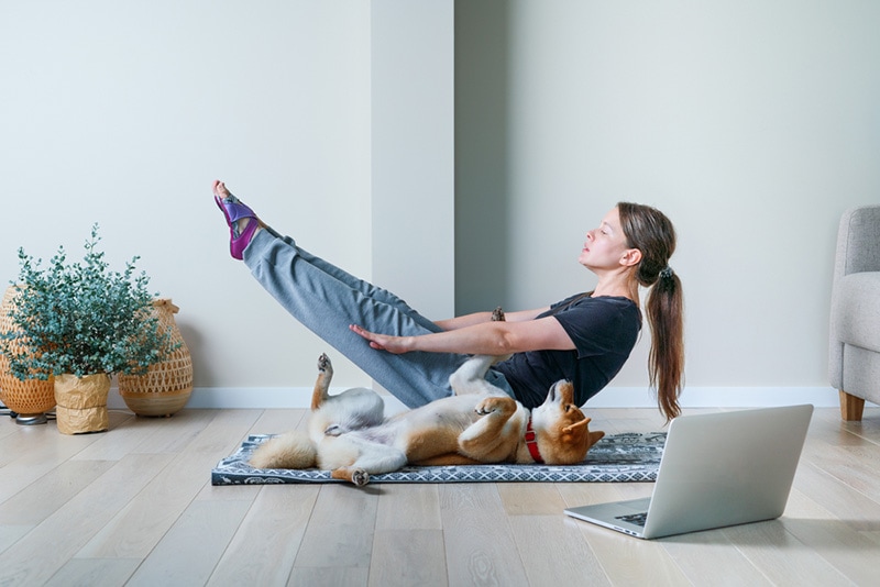 Dog Owner Doing Yoga