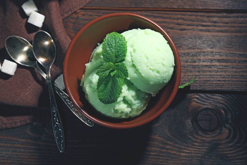scoops of mint ice cream in a bowl