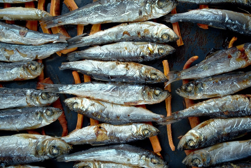 Baked herring with carrots in a pan