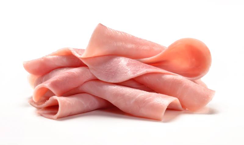 Pork ham sliced on white background