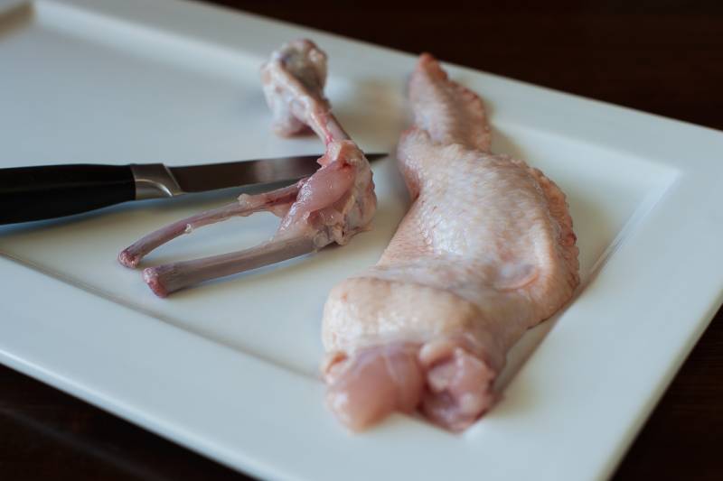Remove bone out of chicken wing