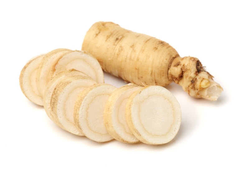 sliced ginseng on white background