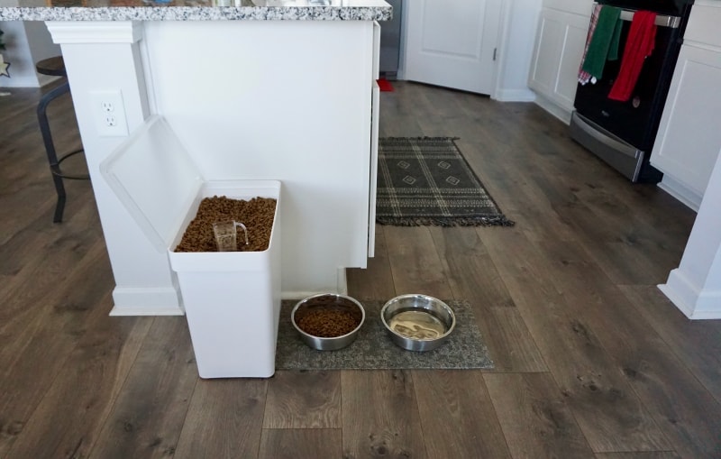 Yamazaki Rolling Airtight Pet Food Container - product next to the feeding bowls