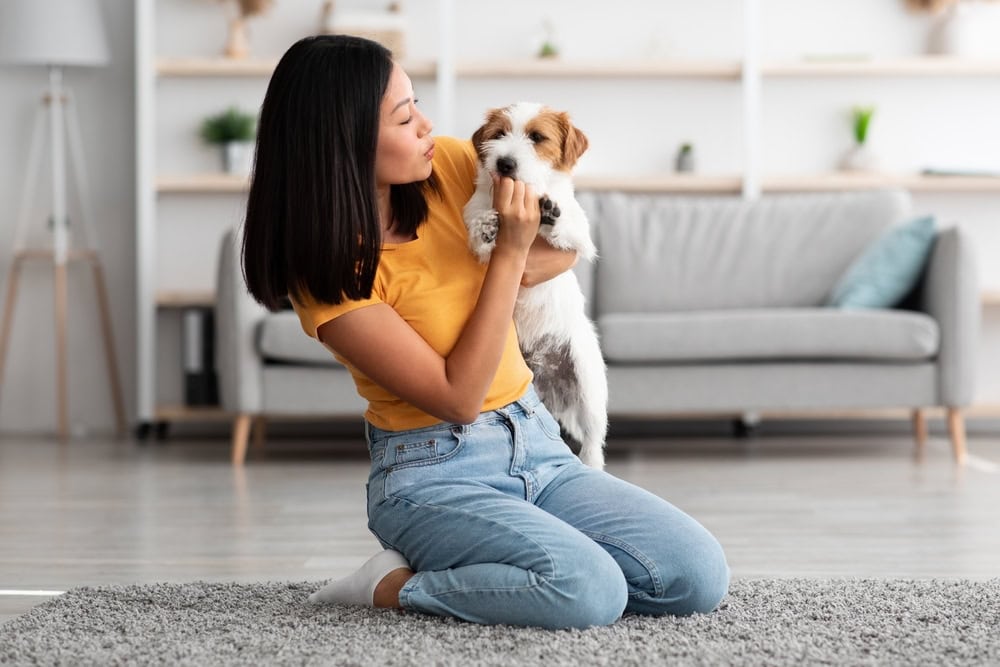woman-giving-treats-to-her-dog