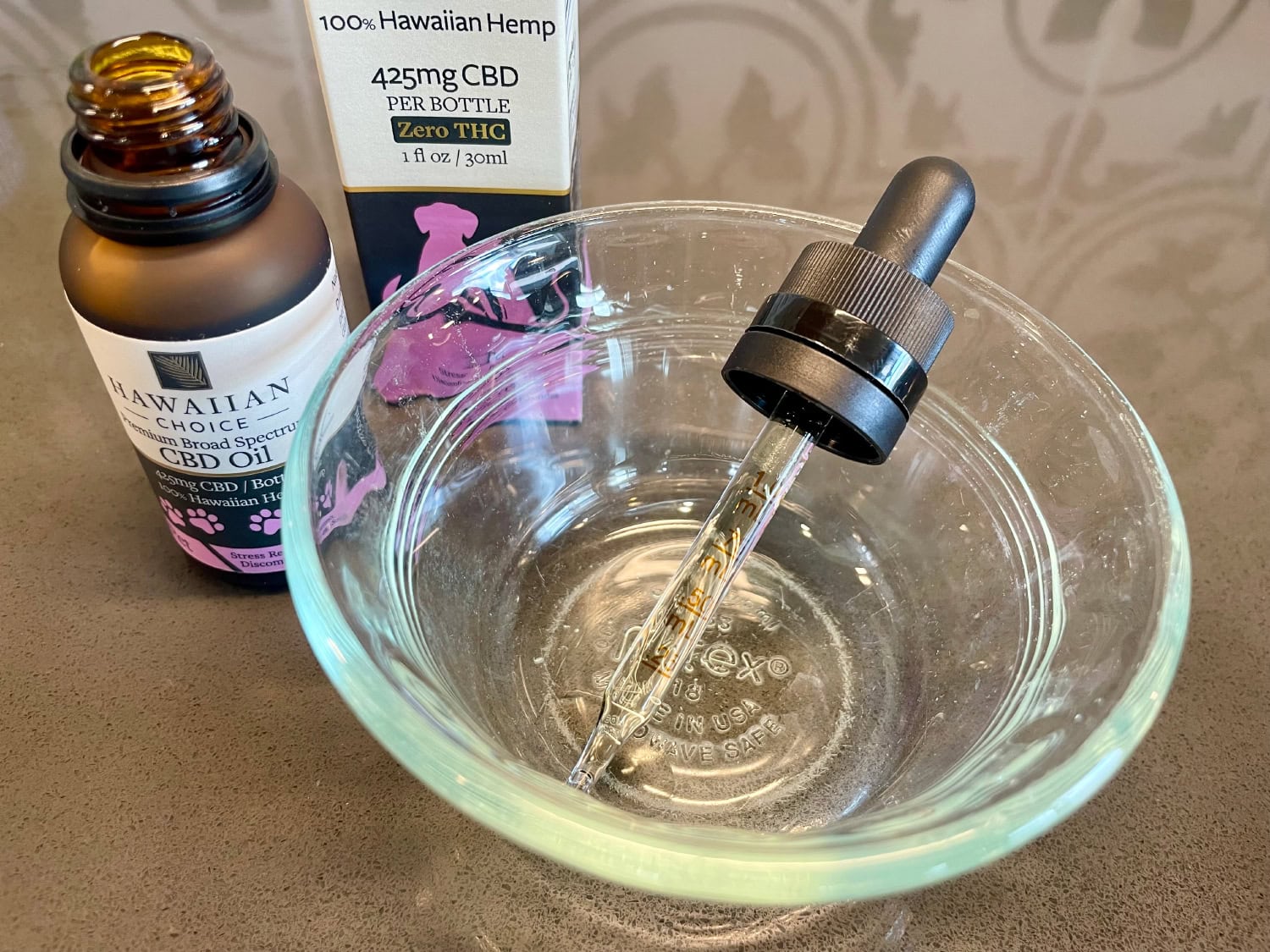 Rare Cannabinoid Company Pet CBD Oil - CBD oil dropper in a bowl