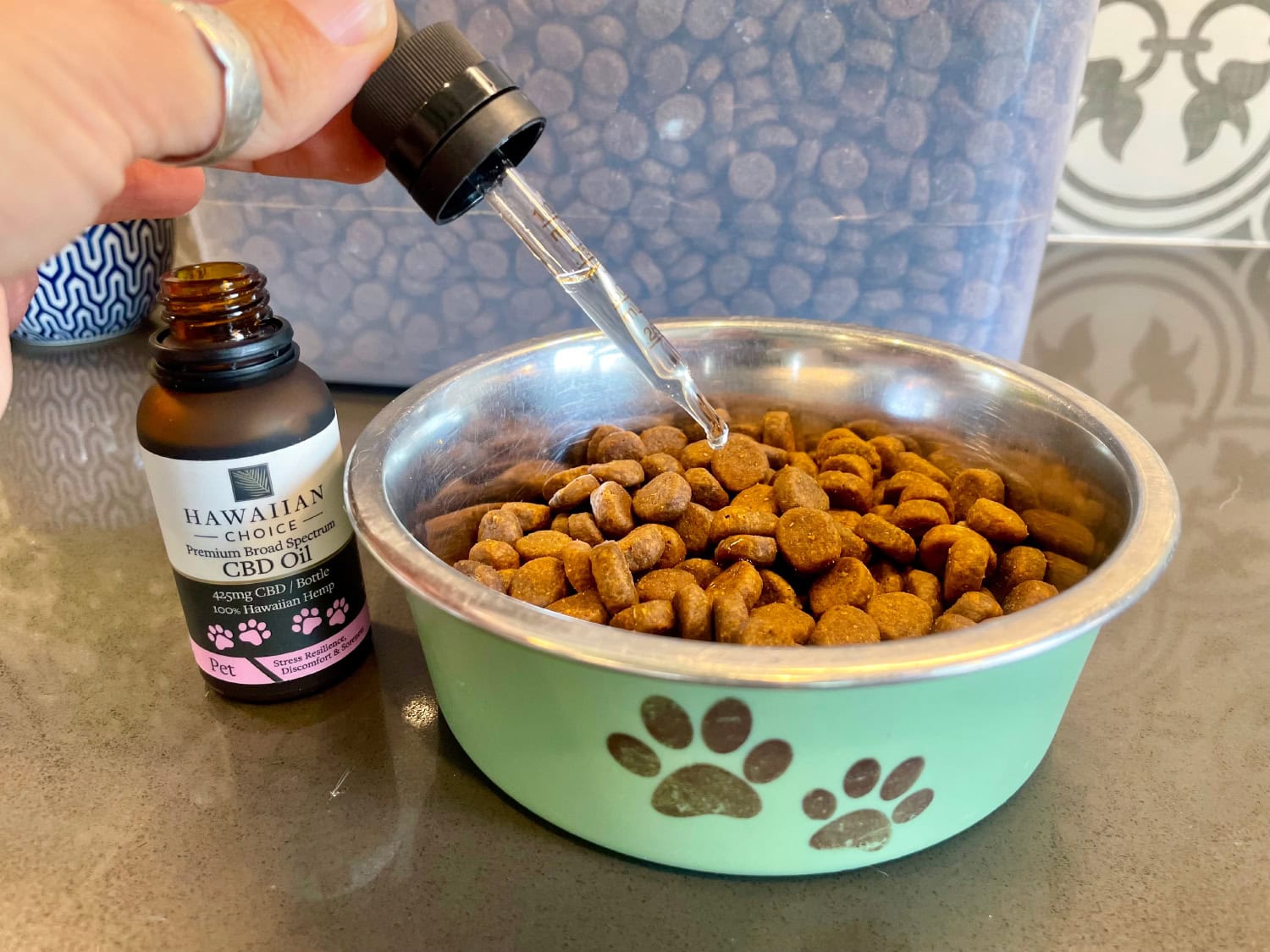 Rare Cannabinoid Company Pet CBD Oil - putting CBD oil on dog food