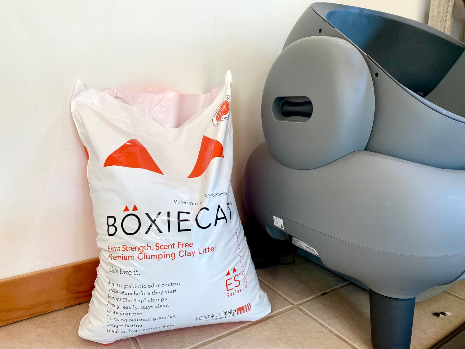 BoxieCat - a sack of cat litter next to the automatic litter box