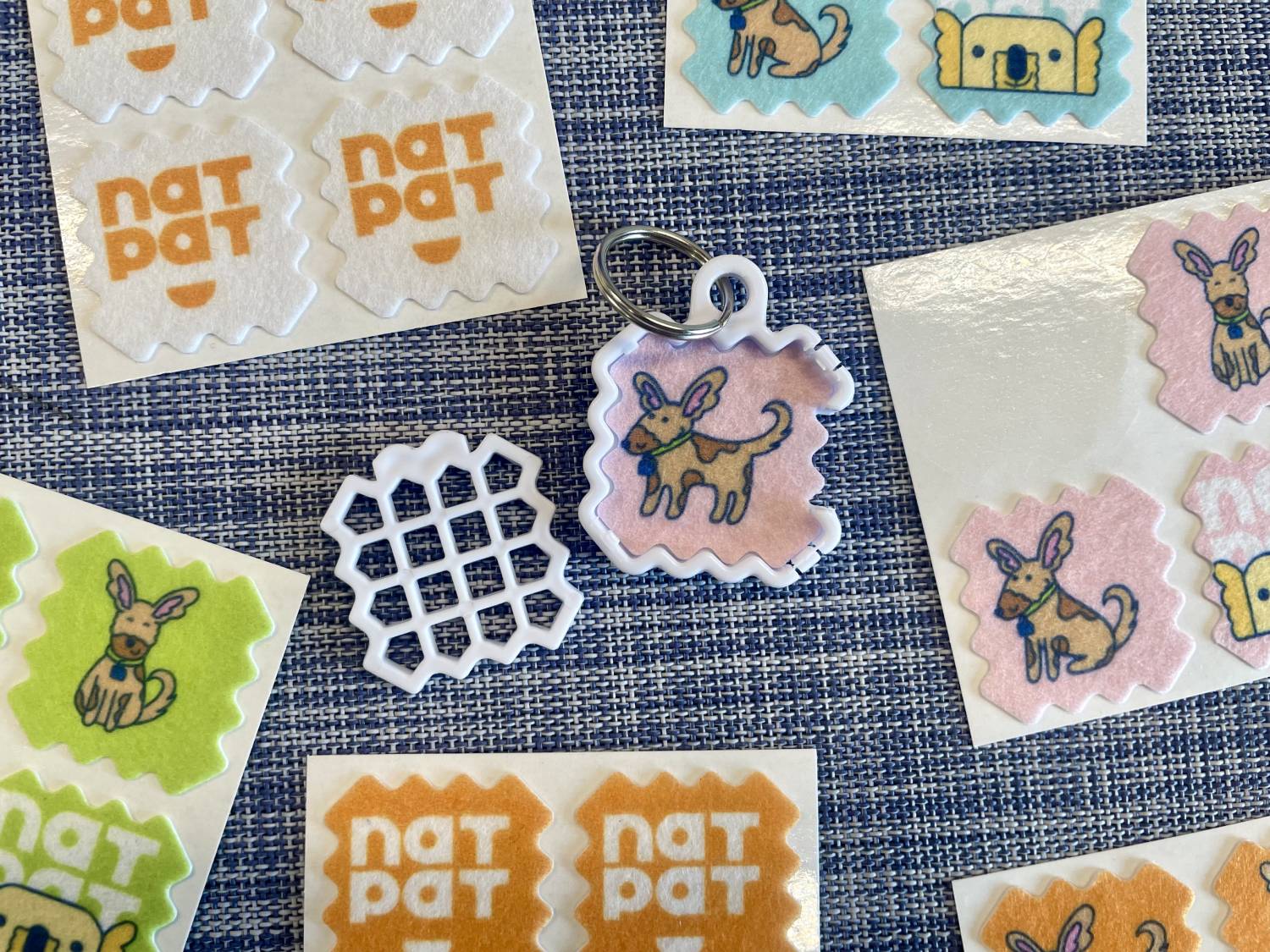 NATPAT Dog Training Aid Stickers Review - close up of stickers and locket
